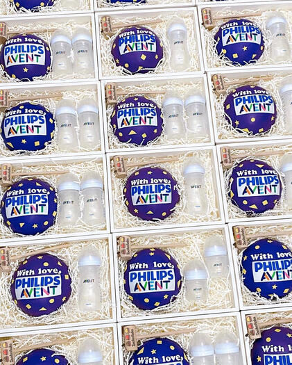 Philips Avent chocolate piñata cake with baby bottles